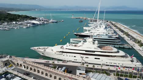 superyachts moored at cannes france drone, aerial slow panning shot