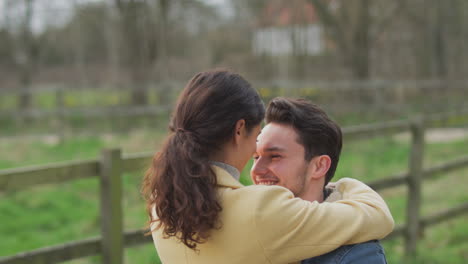 Loving-Transgender-Couple-Hugging-On-Walk-In-Autumn-Or-Winter-Countryside