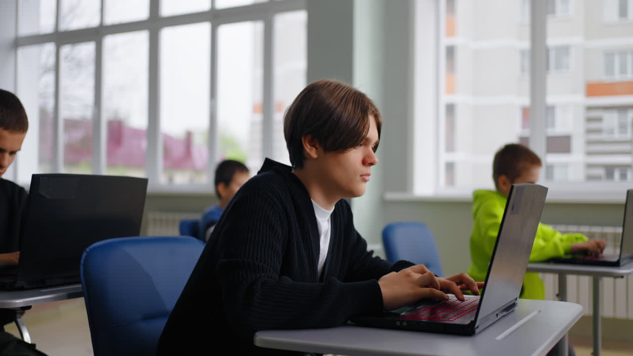 Students Working on Laptops in a Classroom