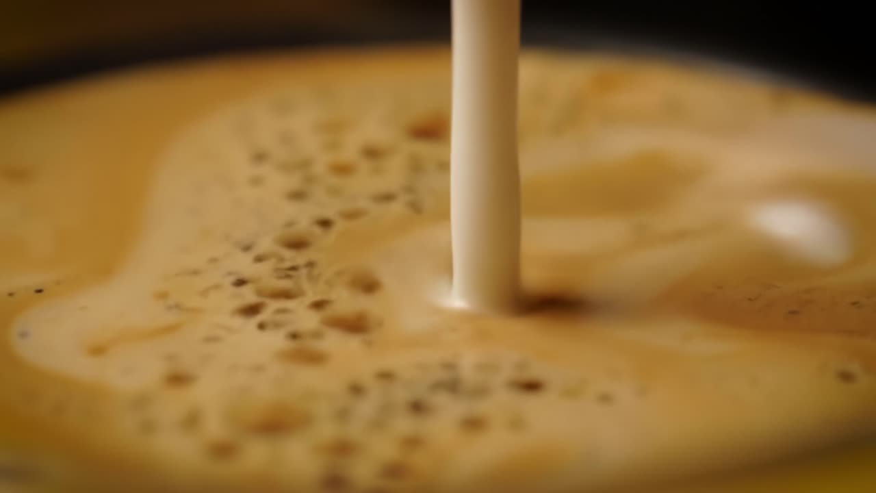 Pouring Milk into Coffee