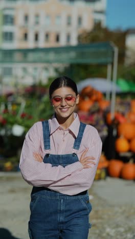 young woman in fashionable outwear at a fall market