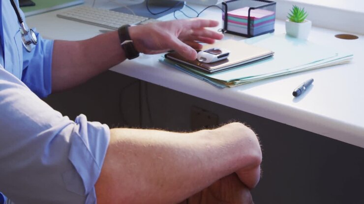 Doctor examining a senior man in a retirement home