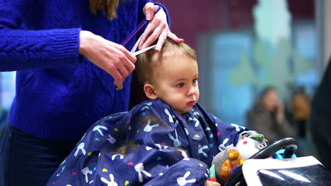 baby getting a haircut