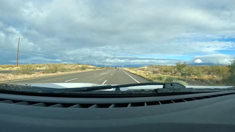 Point-of-view---Driving-on-a-quiet-expressway-thru-rural-Rincon-Valley-of-the-Sonora-Desert-on-cloudy-day-in-southern-Arizona