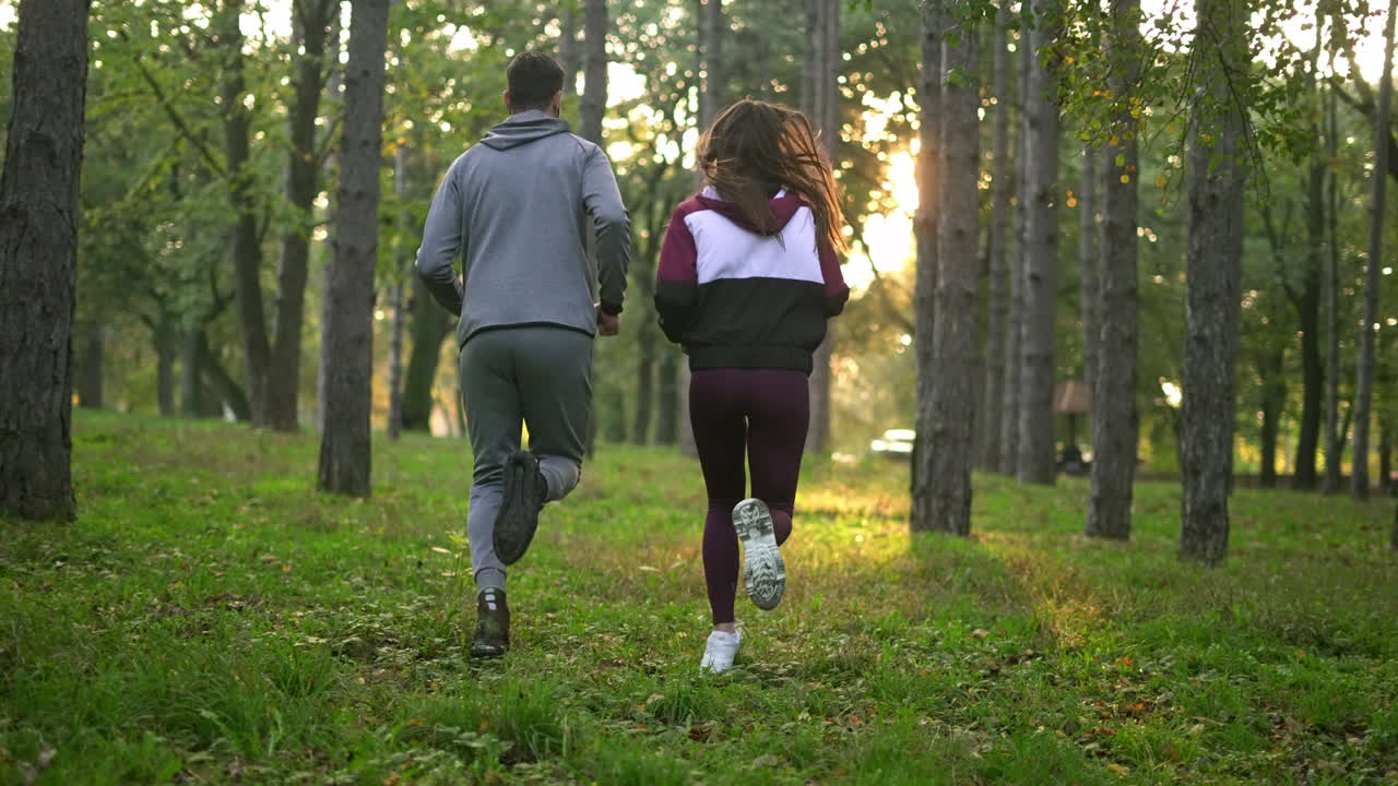 Couple jogging in a forest