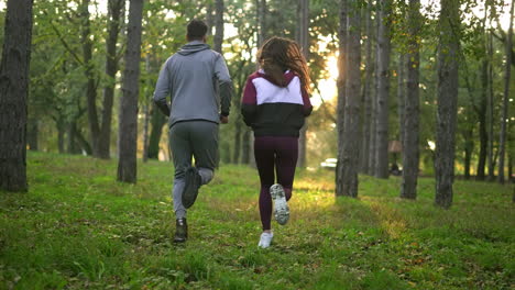 couple jogging in a forest