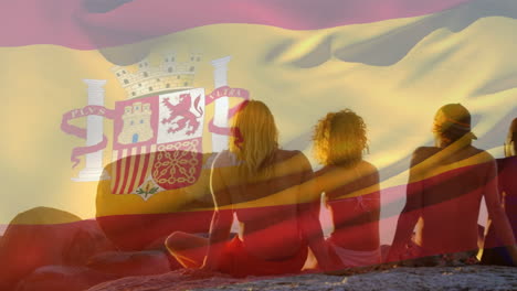 animation of flag of spain over diverse group of friends at beach