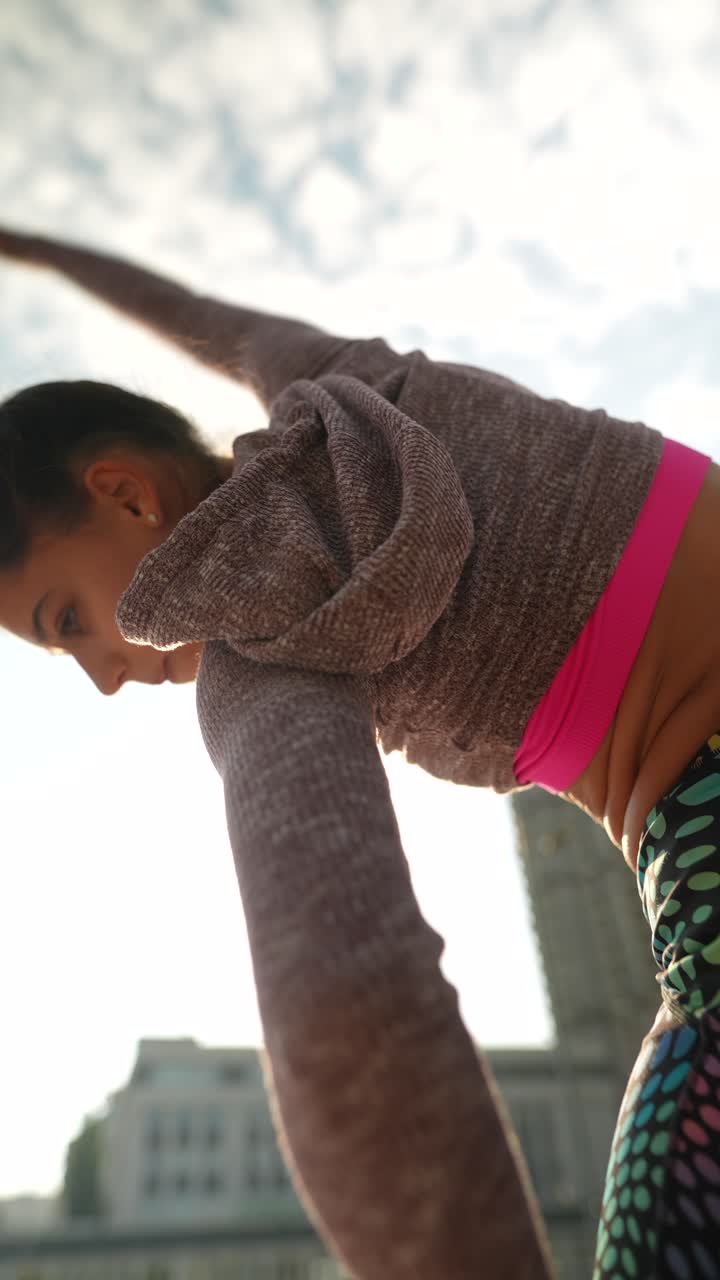Woman in sportswear exercising outdoors