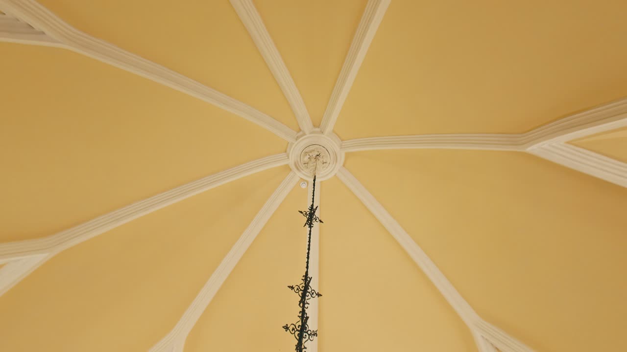 Elegant vaulted ceiling with ornate chandelier in Trakošćan Castle's Hunting Hall.