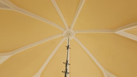 elegant vaulted ceiling with ornate chandelier in trakošćan castle's hunting hall.