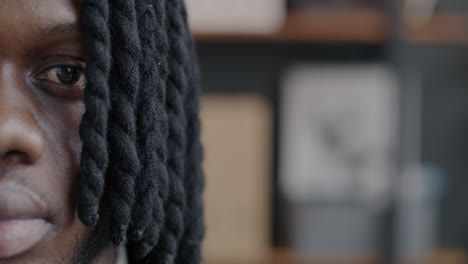 close-up of a man with dreadlocks