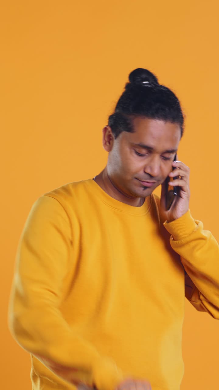 Frustrated Delivery Man Talking on Phone While Checking Order