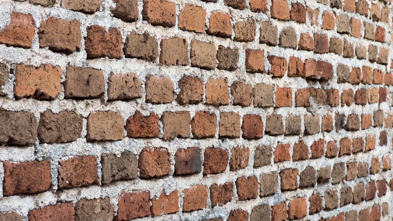 Macro close up of old brick wall texture with rough mortar pattern