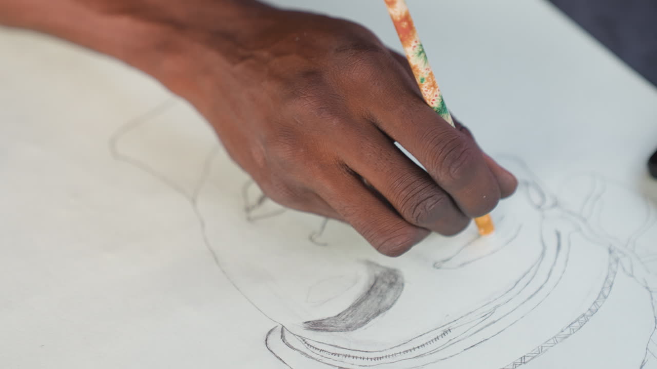 Overhead black hand holding pencil against paper, illustrator refining contour with controlled grip and fast strokes, visible pencil tip contrast, workshop setting, focused skill practice