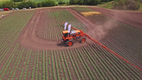 Agricultural-sprayer-watering-plant-on-farming-field.-Farming-industry