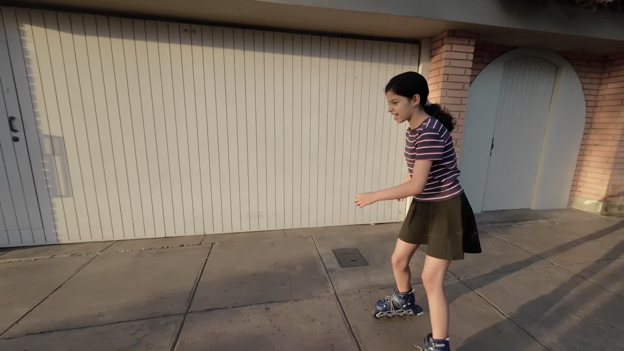 Young Girl Learning to Rollerblade on a Sidewalk