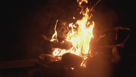 a bonfire being lit with lighter fluid in slow-motion