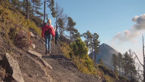 female hikers on trail to volcano slow motion