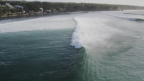 uluwatu surfer catching a huge ocean waves in surfer famous spot in bali island indonesia