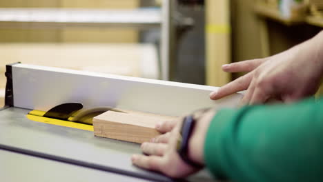 worker using power saw