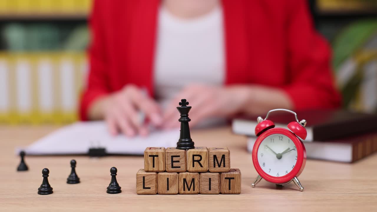 Term Limit Concept with Chess Piece and Alarm Clock