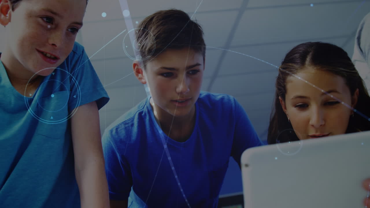 Animation of media icons over diverse schoolchildren using tablet
