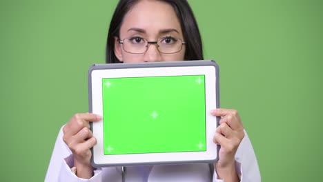 young beautiful asian woman doctor showing digital tablet