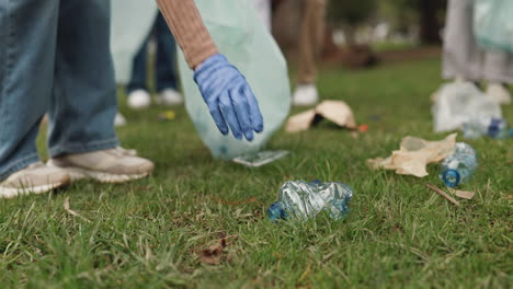 group of volunteers cleaning up a park