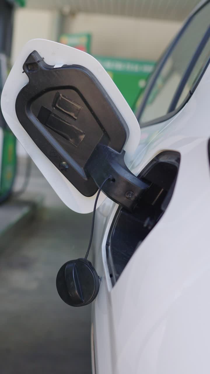 Fuel cap of a car at a gas station