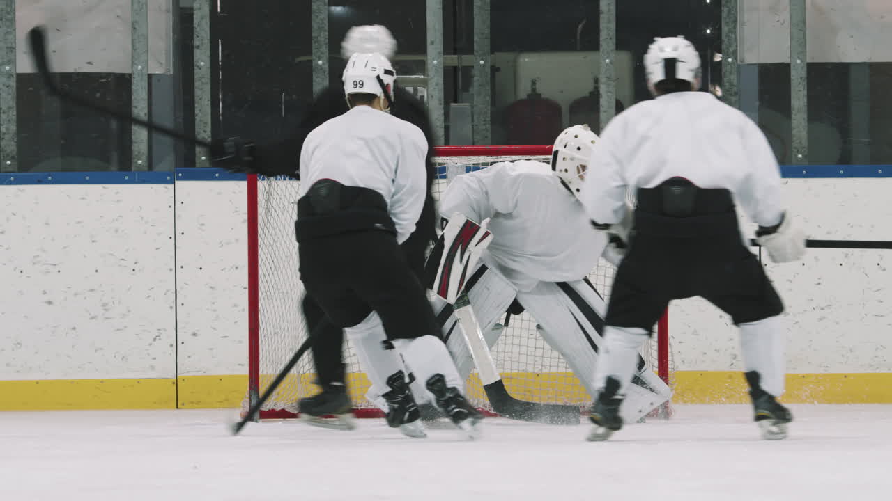 Forwards Scoring Goal During Hockey Game