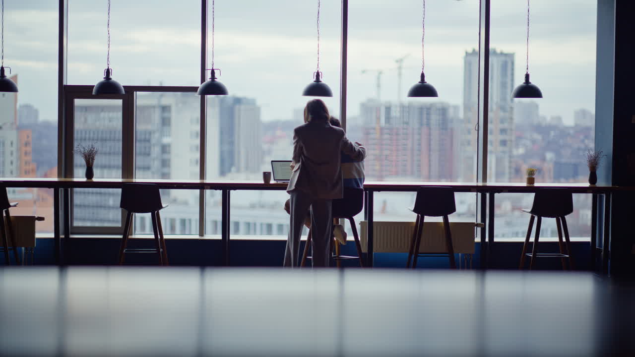 Overjoyed partners looking laptop feeling success office. Colleagues rejoicing
