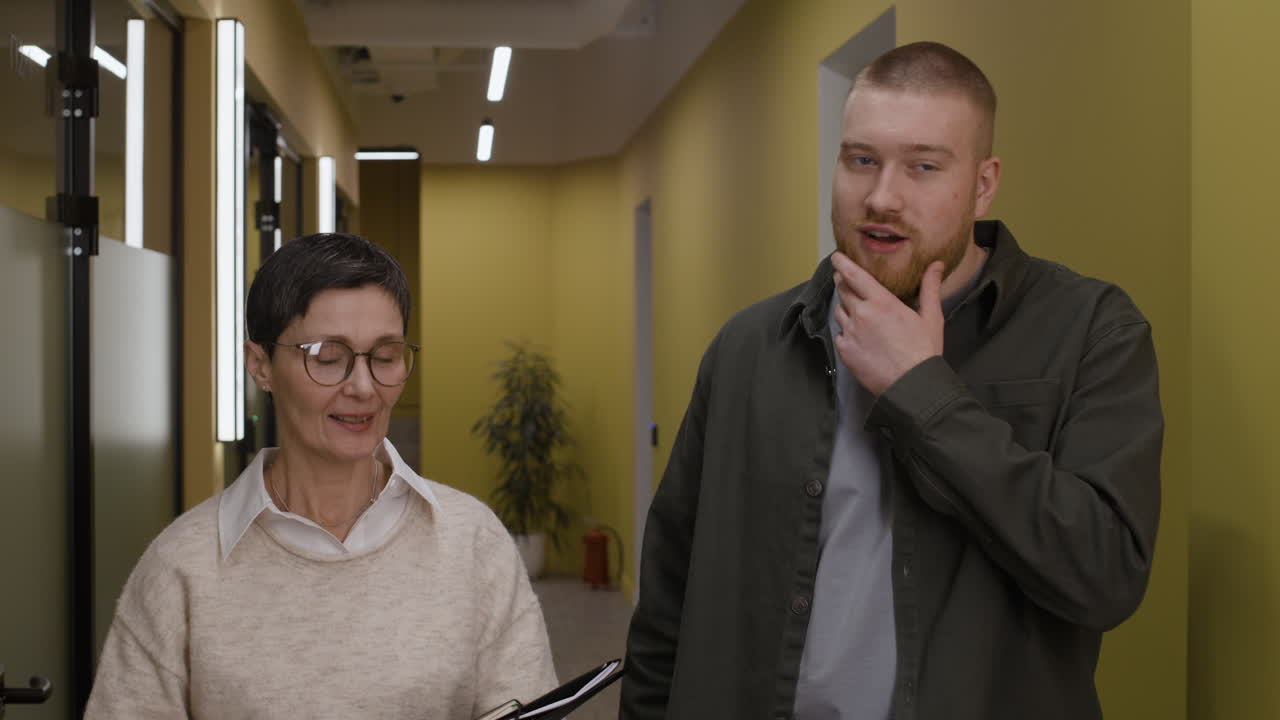 People in an office hallway