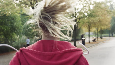 woman running pony tail close up behind shot