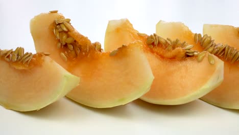 exotic melon fruit close-up. sliced melon on a white background