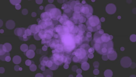 Motion-purple-glitters-and-round-bokeh-on-black-background