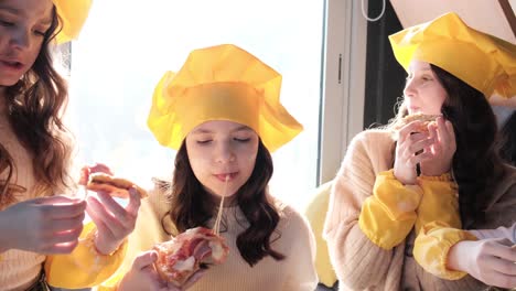 Girls Enjoying Pizza
