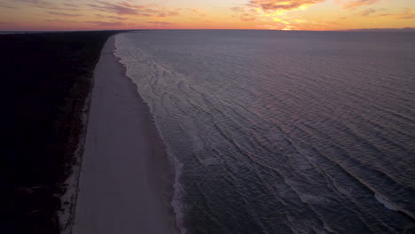 Aerial-drone-high-shot-of-colorful-sunset-over