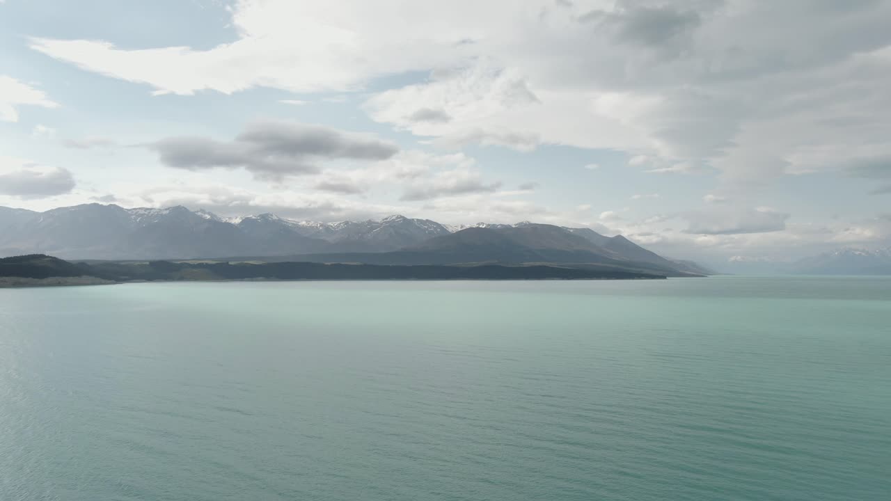 drone shot of lake pukaki going far