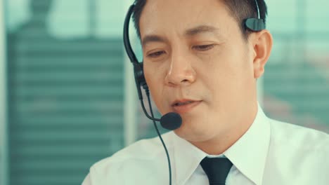 business people wearing headset working actively in office