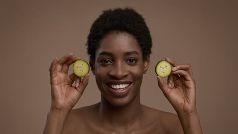 woman with cucumber slices on face