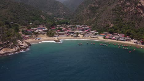 drone-overflight-in-front-of-Puerto-Maya-beach,-located-in-the-state-of-Aragua,-Venezuela