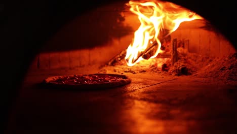 pizza baking in a wood-fired oven