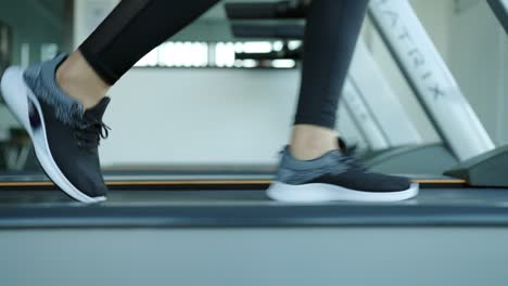 sporty woman running on a treadmill