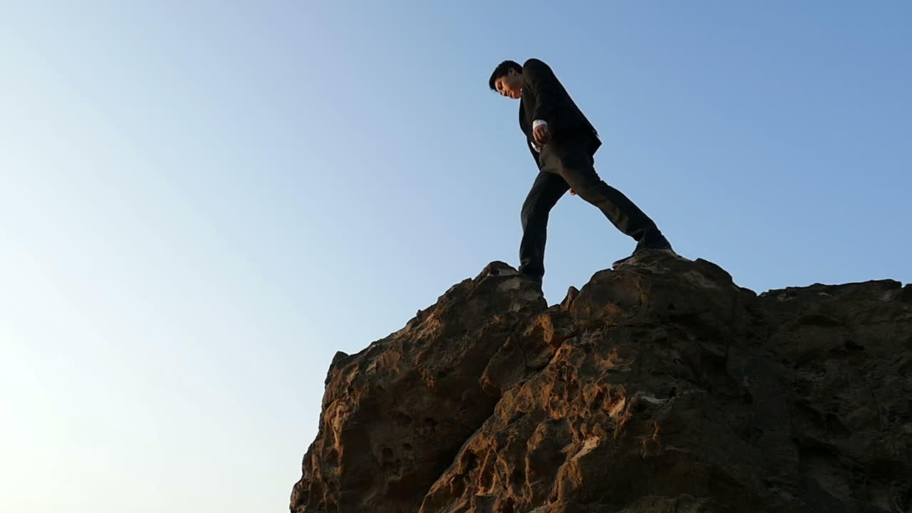 Businessman on a Mountain Top