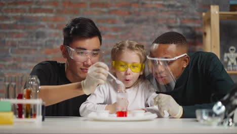 man pours catalyst girl student wondered of rising up drops