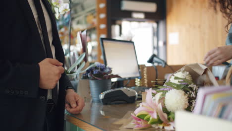 man buying flowers at a florist shop