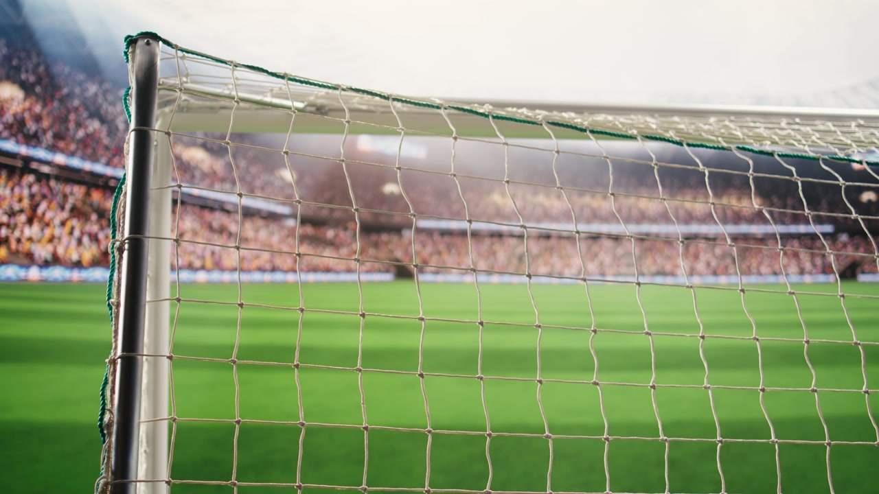 İp düğümlerini ve ızgara dokusunu gösteren futbol kalesi ağının yakın çekimi.