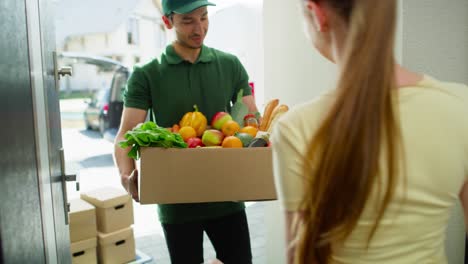 video of woman receiving groceries from delivery person