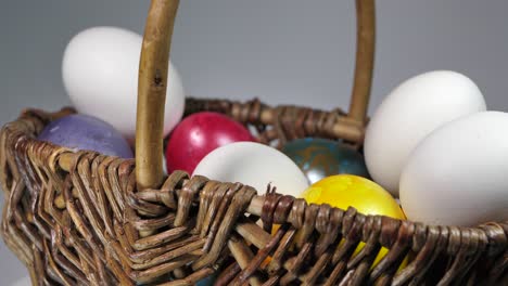 colored eggs rotate in a basket