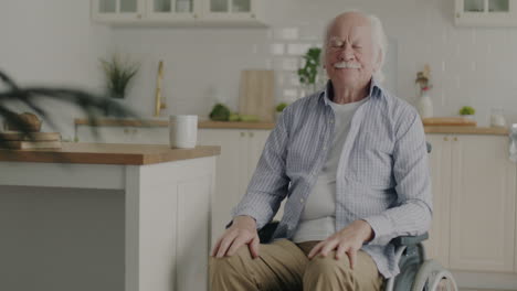 elderly man in wheelchair in kitchen